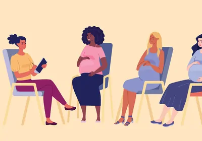 Four pregnant women sitting in chairs